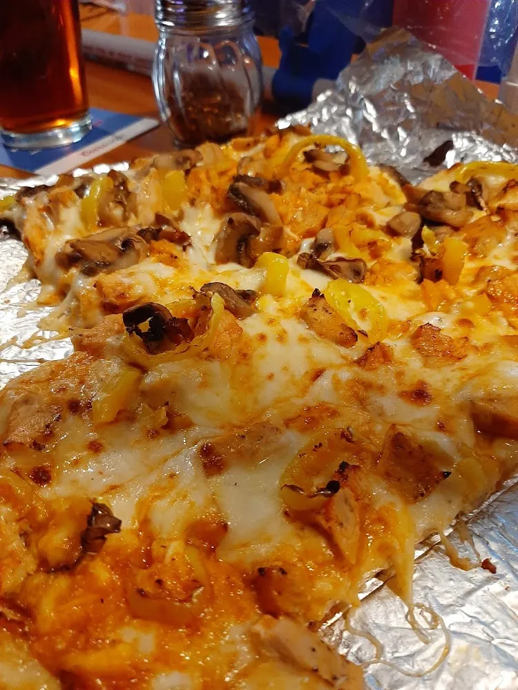 House Pizza with Mushrooms Added to Half